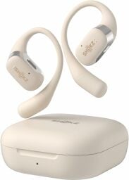 a beige colored pair of shokz openfit headphones and charging case on a white background