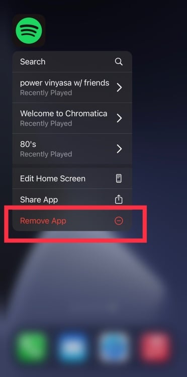 A screenshot of an iPhone Spotify app and the menu allowing you to remove an app.