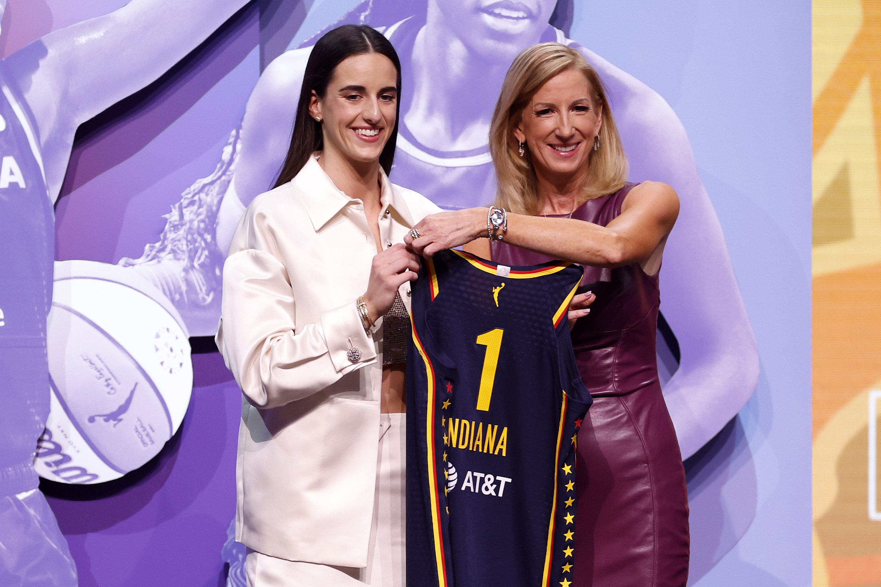 caitlin clark posing with an indiana fever jersey