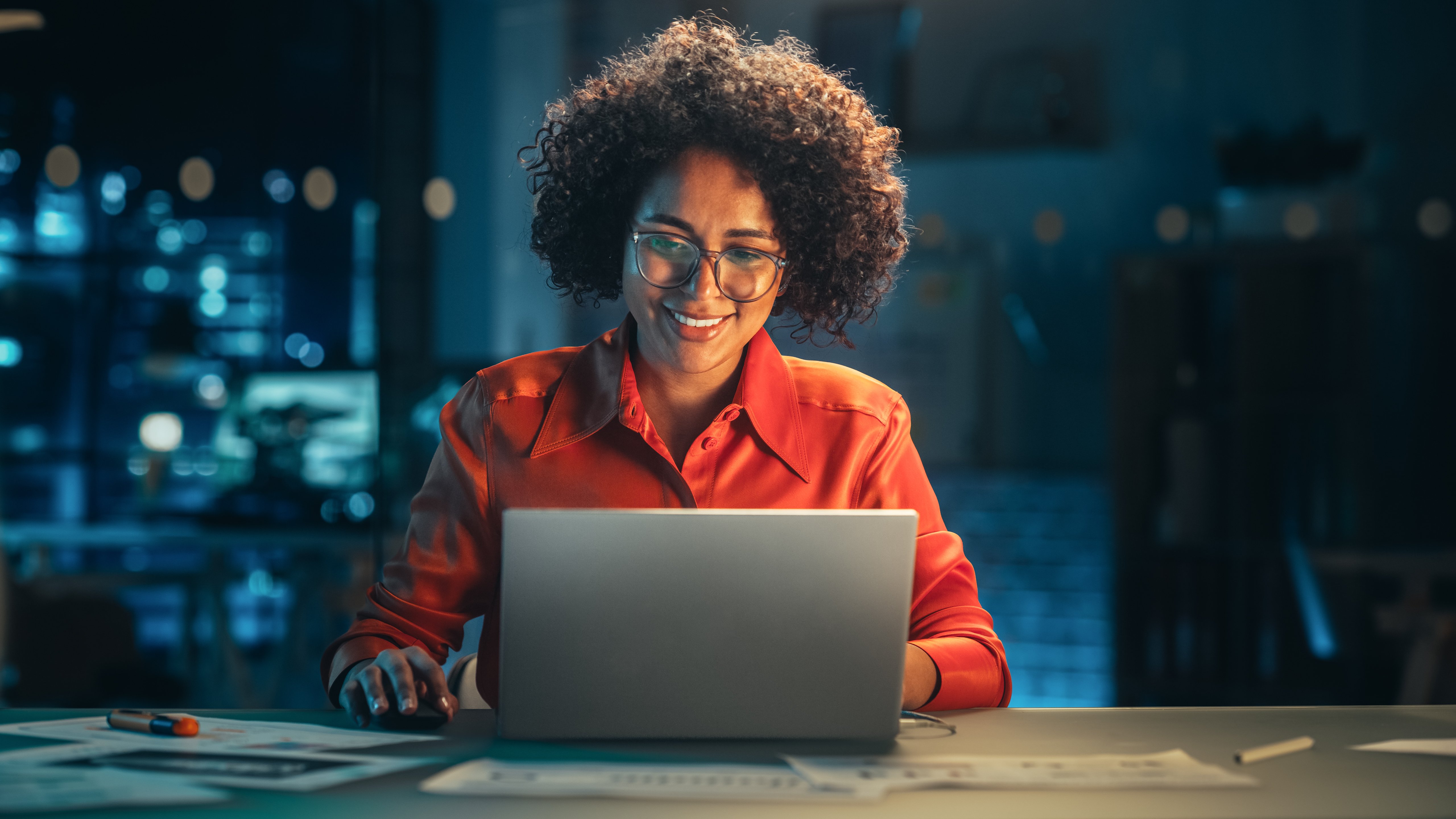 woman smiling at laptop